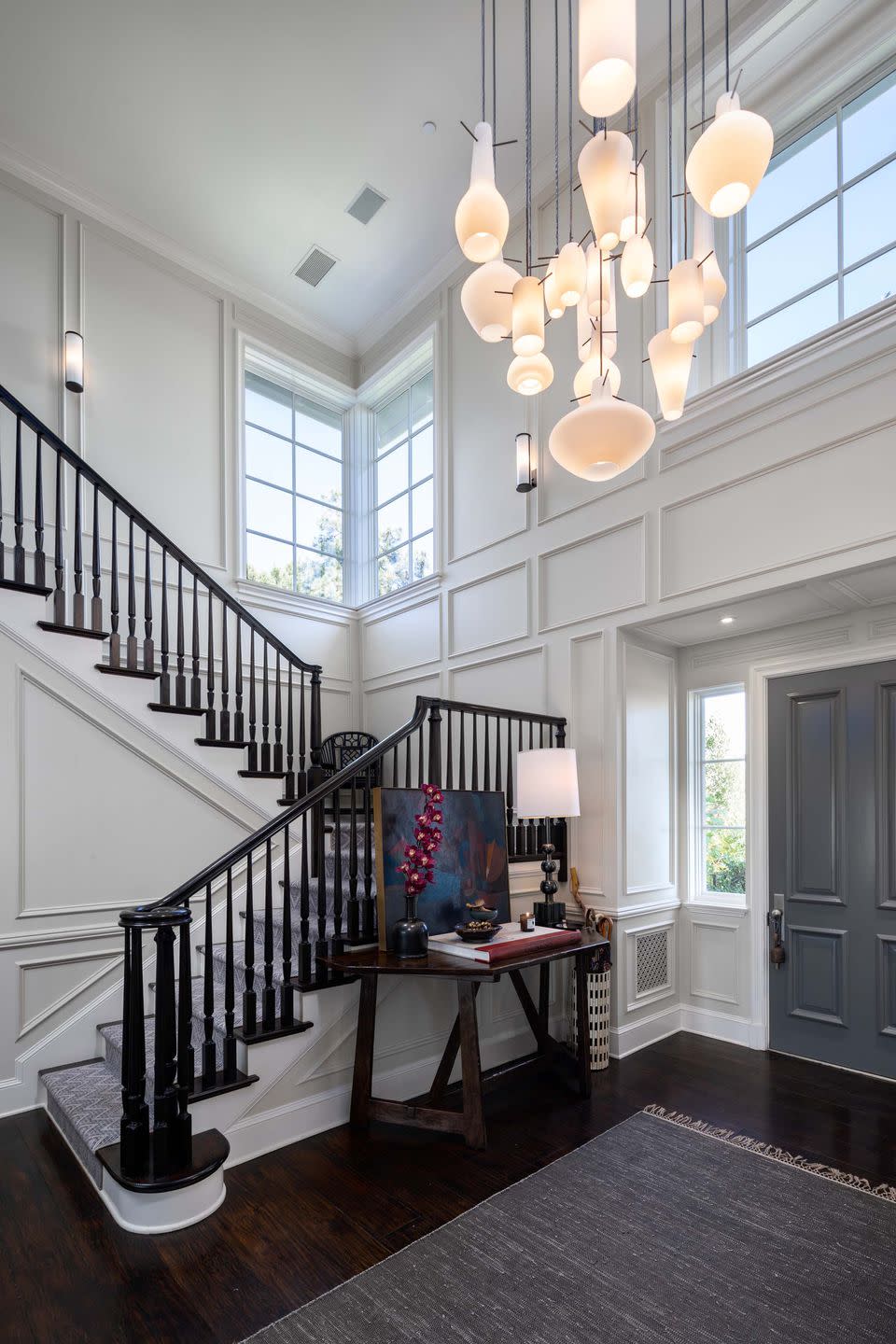 A private garden walkway leads to this two-story formal entry hall.
