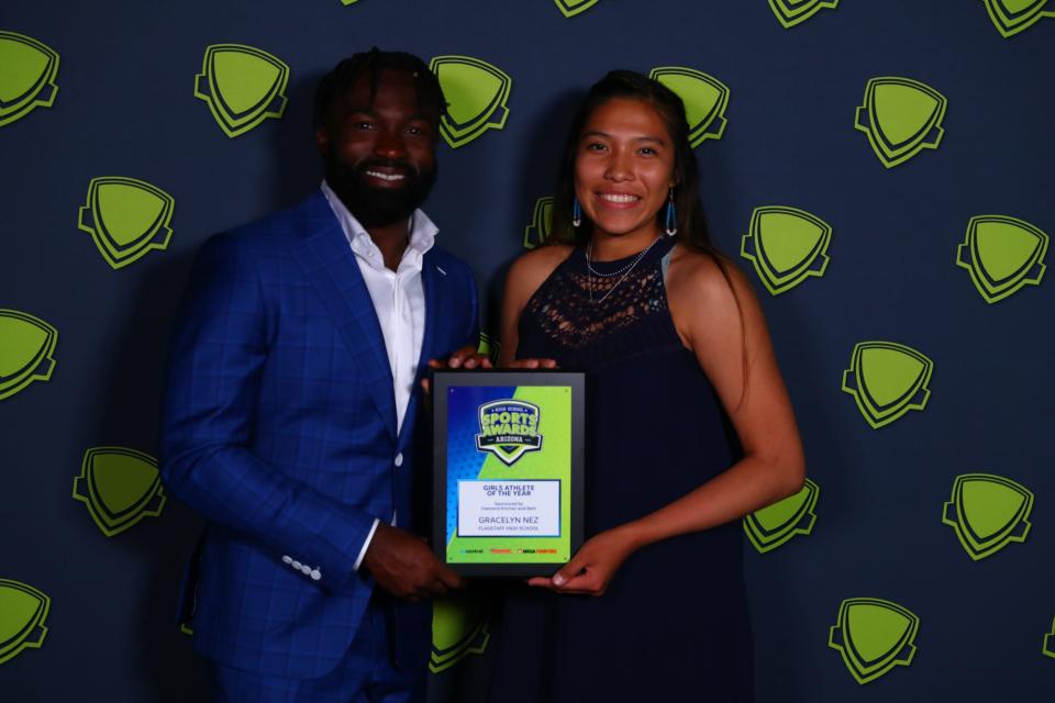 Jun 11, 2022; Tempe, AZ, United States; Gracelyn Nez, Flagstaff, poses for a photo with Arizona Cardinals running back Eno Benjamin at The 2022 Arizona High School Sports Awards at ASU Gammage Theater.