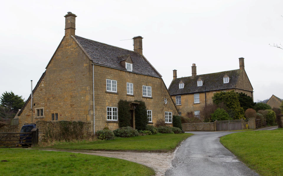 Mr and Mrs Owens now live in separate houses next door to each other in Broadway, Worcestershire, with Mrs Owens residing in the detached property on the left and her husband on the right. (SWNS)