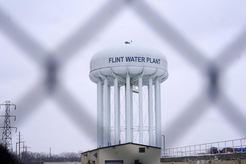 FILE - The Flint water plant tower is seen on Jan. 6, 2022, in Flint, Mich. A Michigan judge dismissed charges Tuesday, Oct. 4, 2022, against seven people in the Flint water scandal, including two former state health officials blamed for deaths from Legionnaires' disease. Judge Elizabeth Kelly took action three months after the Michigan Supreme Court said a one-judge grand jury had no authority to issue indictments. (AP Photo/Carlos Osorio, File)