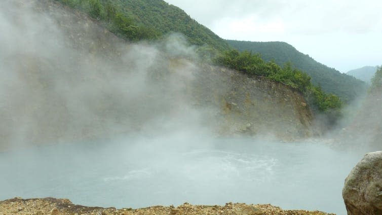 Steamy lake with forest in background