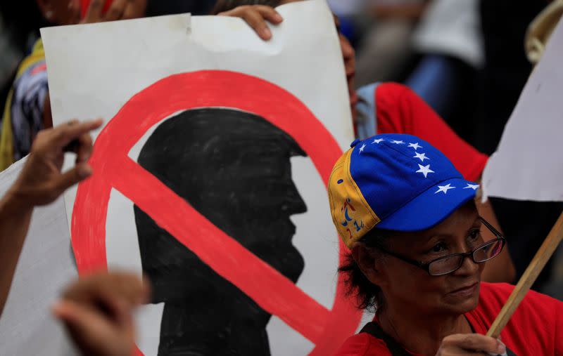 FILE PHOTO: Supporters of Venezuela's President Nicolas Maduro attend a rally against U.S. President Donald Trump in Caracas