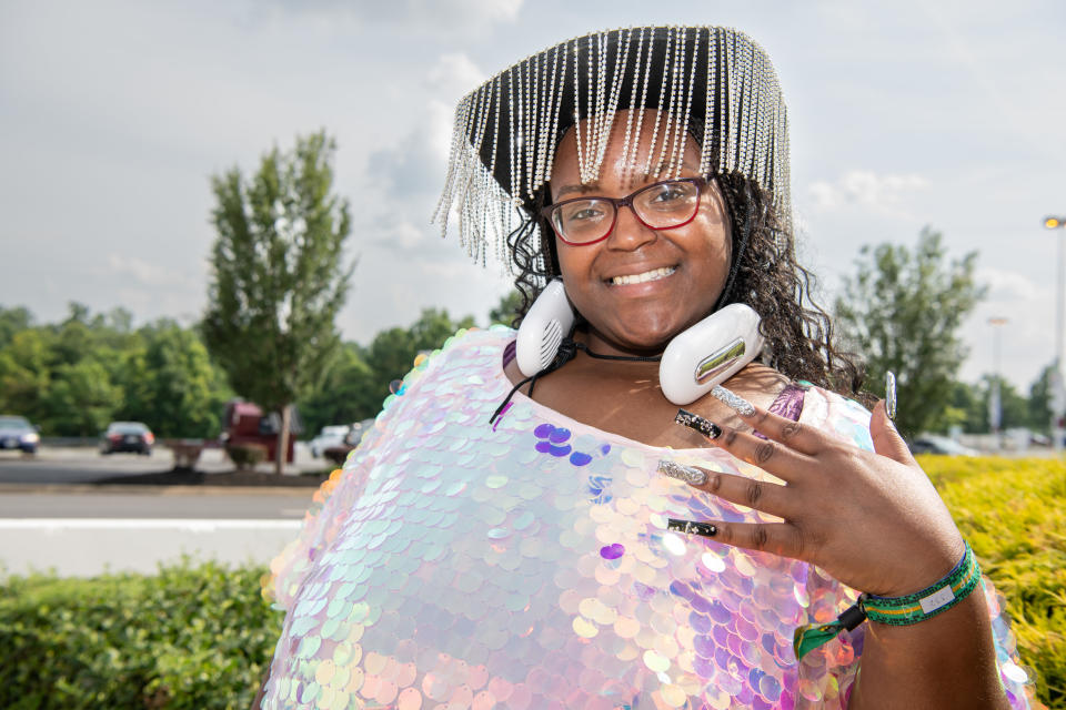 Brianna Mallard, of Washington, D.C., arriving for a Beyoncé show, in fancy attire, a spangled hat and glamorous fingernails.