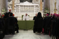 Pope Francis listens to a welcome speech inside the St. Nicholas Basilica on the occasion of the "Mediterranean sea a border of peace" conference in Bari, Italy, Sunday, Feb. 23, 2020. (AP Photo/Gregorio Borgia)