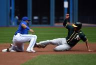 May 20, 2018; Toronto, Ontario, CAN; Toronto Blue Jays shortstop Richard Urena (7) tags out Oakland Athletics shortstop Marcus Semien (10) on an attempted steal of second in the first inning at Rogers Centre. Mandatory Credit: Dan Hamilton-USA TODAY Sports