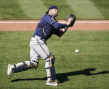 Milwaukee Brewers catcher Manny Pina drops a popup in foul territory by St. Louis Cardinals' Nolan Arenado during the seventh inning of a baseball game Sunday, April 11, 2021, in St. Louis. (AP Photo/Jeff Roberson)