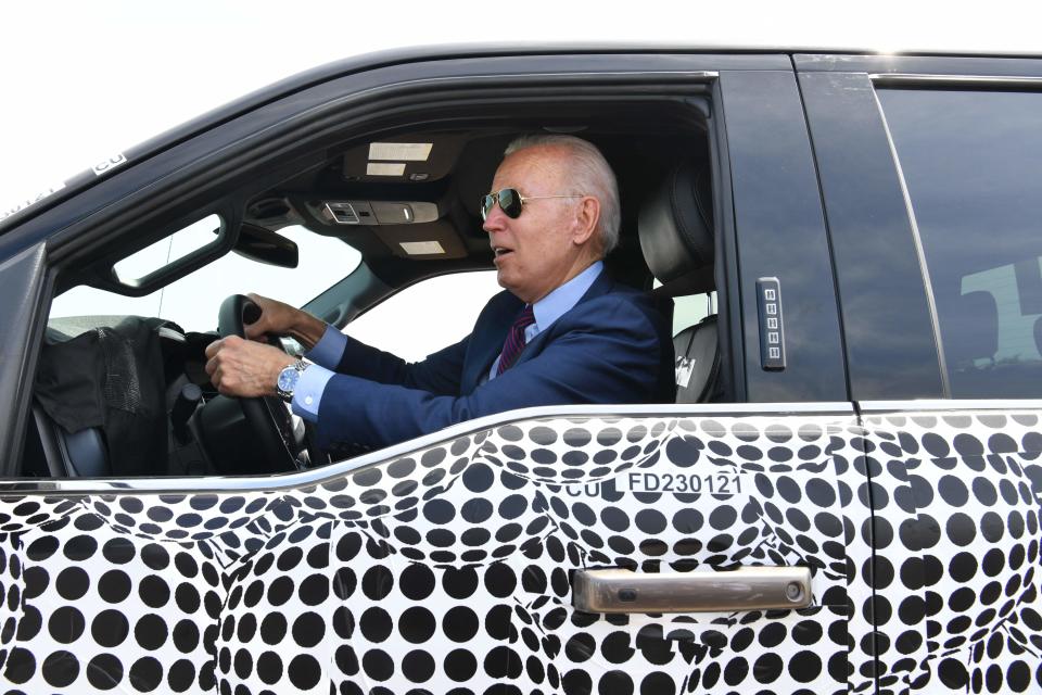 US President Joe Biden drives a F150 electric truck at the Ford Dearborn Development Center in Dearborn, Michigan on May 18, 2021.