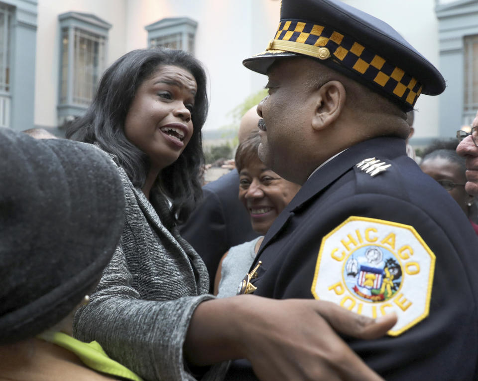 FILE - In this Dec. 1, 2016, file photo, Kim Foxx, left, greets Police Superintendent Eddie Johnson at her swearing in ceremony as the new Cook County State's Attorney in Chicago. The outrage was swift and overwhelming: How could prosecutors in Chicago drop charges against former "Empire" cast member Jussie Smollett for allegedly orchestrating a fake attack and allow him to wipe his record clean without so much as an apology? But for all of the public outrage, the Chicago Police Department and Cook County State's Attorney's Office insist their relationship is strong, even if they didn't agree on the outcome in Smollett's case. (Nancy Stone/Chicago Tribune via AP, File)