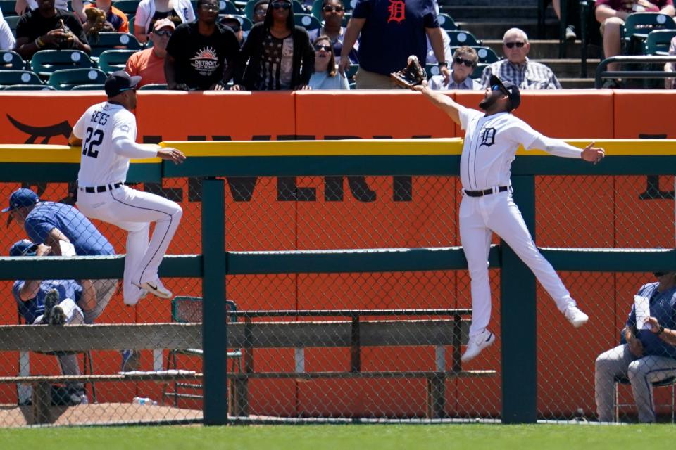 Detroit Tigers center fielder Riley Greene, right, can't reach a Kansas City Royals' Emmanuel Rivera two-run home run as right fielder Victor Reyes (22) looks on in the second inning of a baseball game in Detroit, Sunday, July 3, 2022.