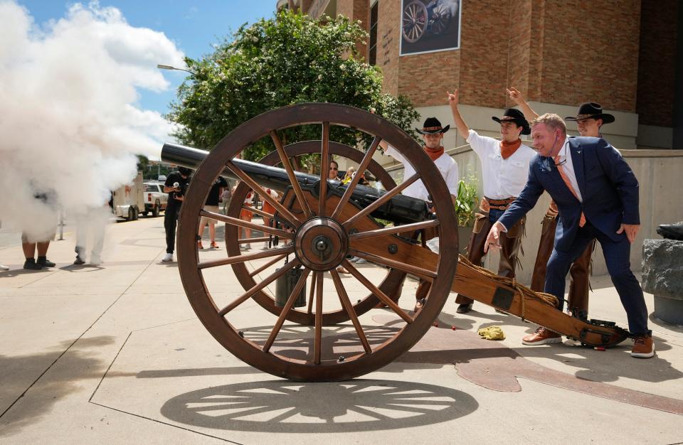 New Texas baseball coach Jim Schlossnagle fires Smokey The Cannon on Wednesday, when he was introduced as the Longhorns' head coach. Schlossnagle was hired away from soon-to-be SEC rival Texas A&M, which fell to Tennessee in Monday night's national championship game. Texas named Schlossnagle its coach the next day.