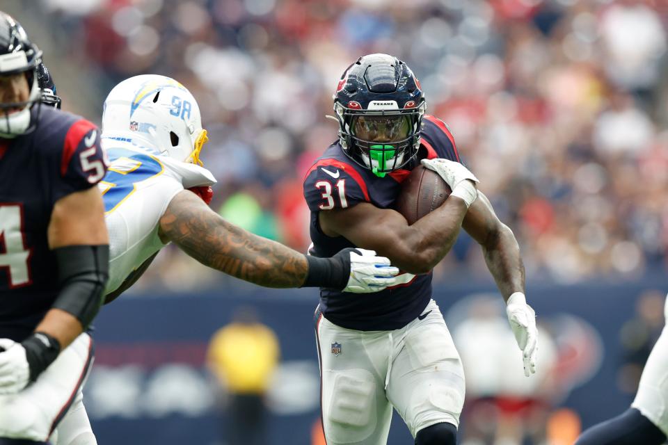 Houston Texans running back Dameon Pierce (32) carries the ball during an NFL football game against the Los Angeles Chargers on Sunday, October 2, 2022, in Houston. (AP Photo/Matt Patterson)