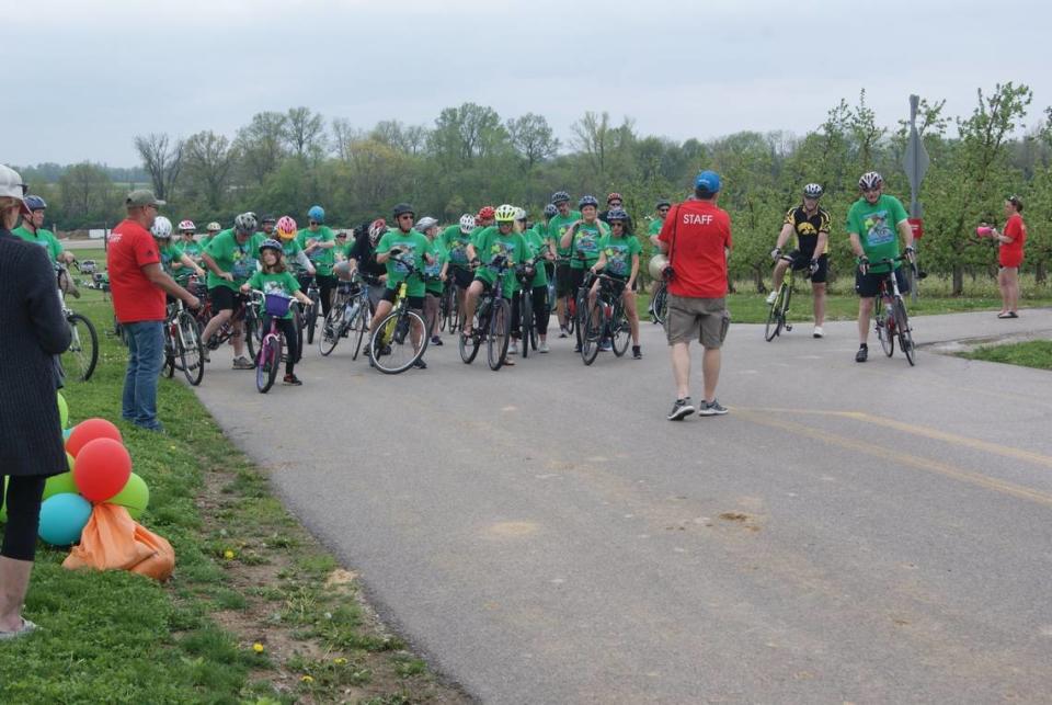 Bicyclists wait to start Tour de Belleville in 2022, when the pre-ride party was moved to Eckert’s Orchard and routes included a rural bike trail and streets in The Orchards subdivision.