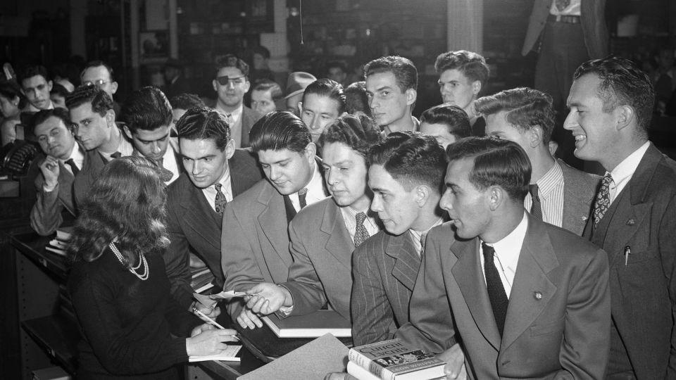 Veterans in 1945 receive books and notebooks — as well as tuition and other fees — under the GI Bill of Rights. Though the bill was neutral in its language, it often excluded Black servicemembers in practice. - Bettmann/Getty Images