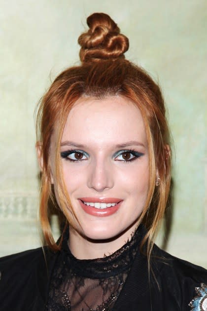 <p><strong>September 2014</strong></p> <p>Here, the starlet stuns in a twisted topknot paired with aqua cat-eye liner.</p>