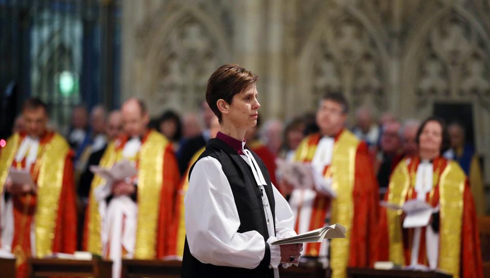 The Reverend Libby Lane reacts during a service where she was consecrated as the first female Bishop in the Church of England at York Minster in York