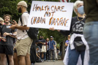 Protesters gather outside Atlanta City Hall ahead of a council vote over whether to approve public funding for the construction of a proposed police and firefighter training center, Monday, June 5, 2023. (Arvin Temkar/Atlanta Journal-Constitution via AP)