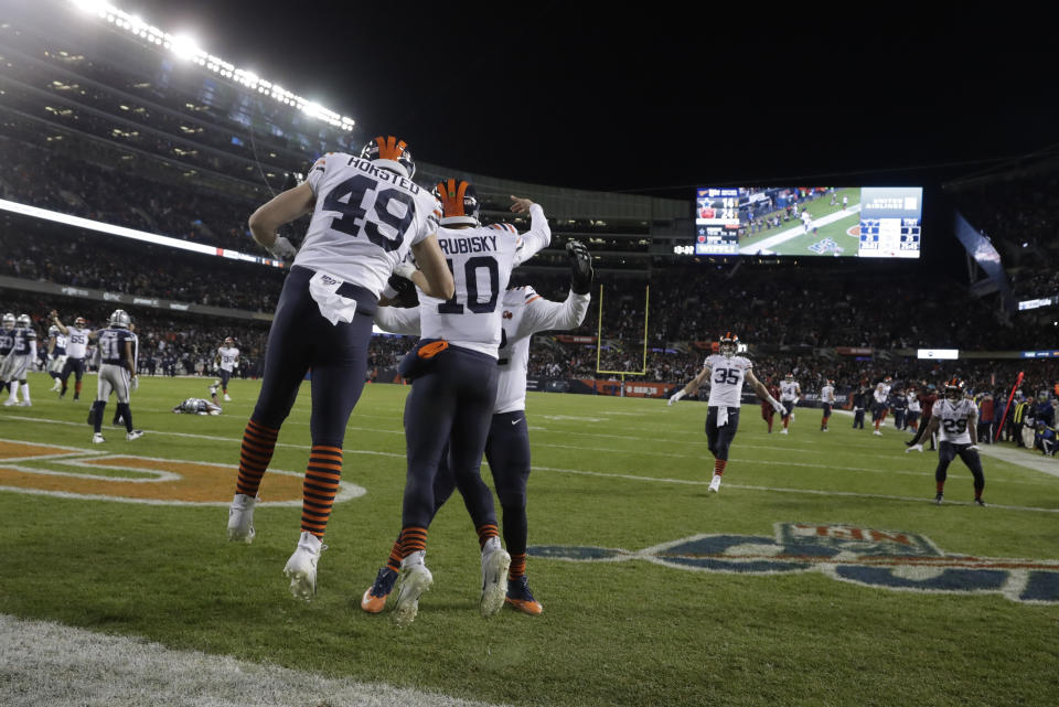 Chicago Bears quarterback Mitchell Trubisky (10) celebrates with teammates after Trubisky ran for a touchdown during the second half of an NFL football game against the Dallas Cowboys, Thursday, Dec. 5, 2019, in Chicago. (AP Photo/Morry Gash)