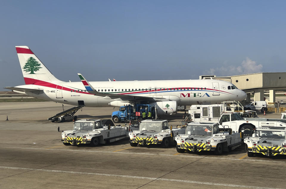 FILE - Middle East Airlines jet grounded at the Rafik Hariri International Airport, in Beirut, Lebanon, Tuesday, Nov. 1, 2022. Stray bullets from gunfire celebrations for the new year hit two parked Middle East Airlines jets at Beirut's airport causing minor damage to the planes without hurting anyone, an airlines official said Sunday, Jan. 1, 2023. (AP Photo/Hussein Malla, File)