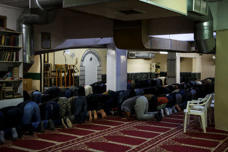 Muslims living in Greece attend Friday prayers at the Masjid Al-Salam makeshift mosque in Athens, Greece, February 3, 2017. REUTERS/Alkis Konstantinidis