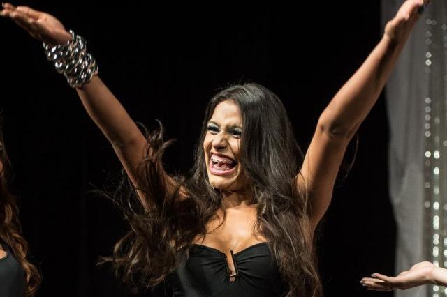 Raika Ferraz smiles after winning the Miss T Brasil 2013