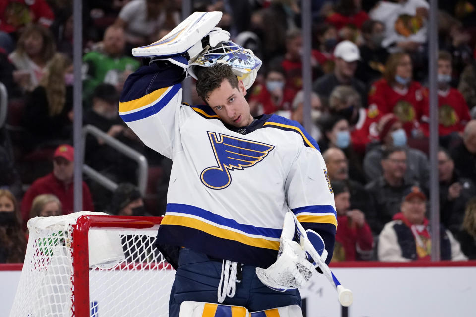 St. Louis Blues goaltender Jordan Binnington puts his helmet on during the first period of an NHL hockey game against the Chicago Blackhawks in Chicago, Friday, Nov. 26, 2021. (AP Photo/Nam Y. Huh)