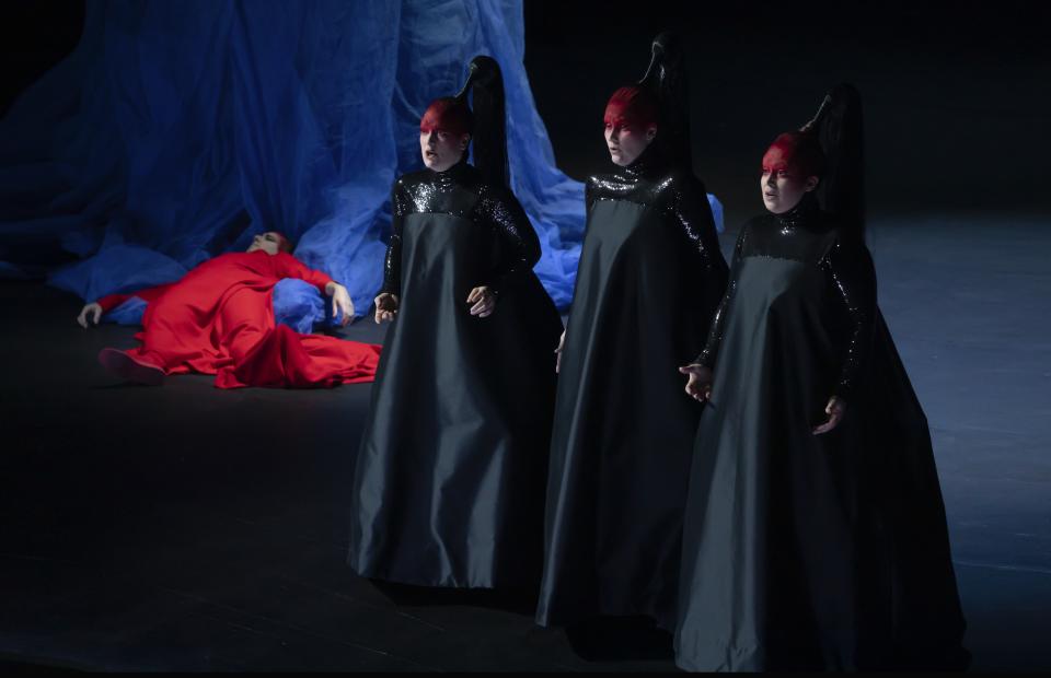 Cyrille Dubois as Tamino flanked by the three ladies in "The Magic Flute"