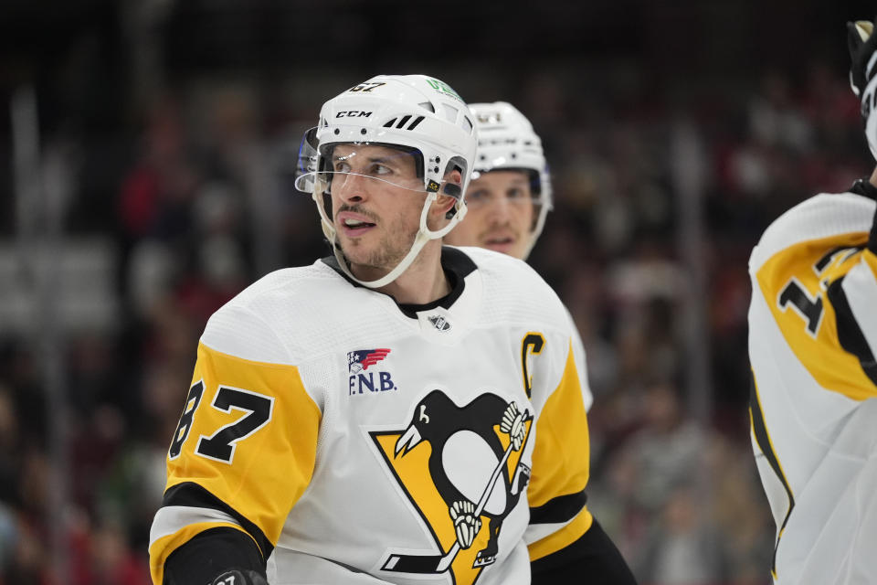 Pittsburgh Penguins center Sidney Crosby prepares for a faceoff during the third period of the team's NHL hockey game against the Chicago Blackhawks, Thursday, Feb. 15, 2024, in Chicago. The Penguins won 4-1. (AP Photo/Erin Hooley)