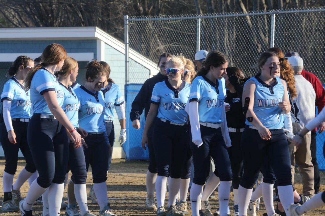 Members of the York High School softball team walk off the field following Monday's season-opening 10-0 win over rival Wells.