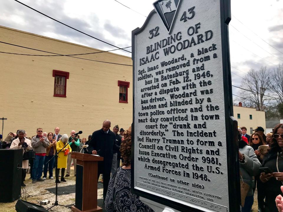 The Blinding of Isaac Woodard historical marker was dedicated in Batesburg-Leesville, S.C., on Saturday, Feb. 9, 2019. The bottom portion of the marker is written in Braille. (AP Photo/Christina Myers)