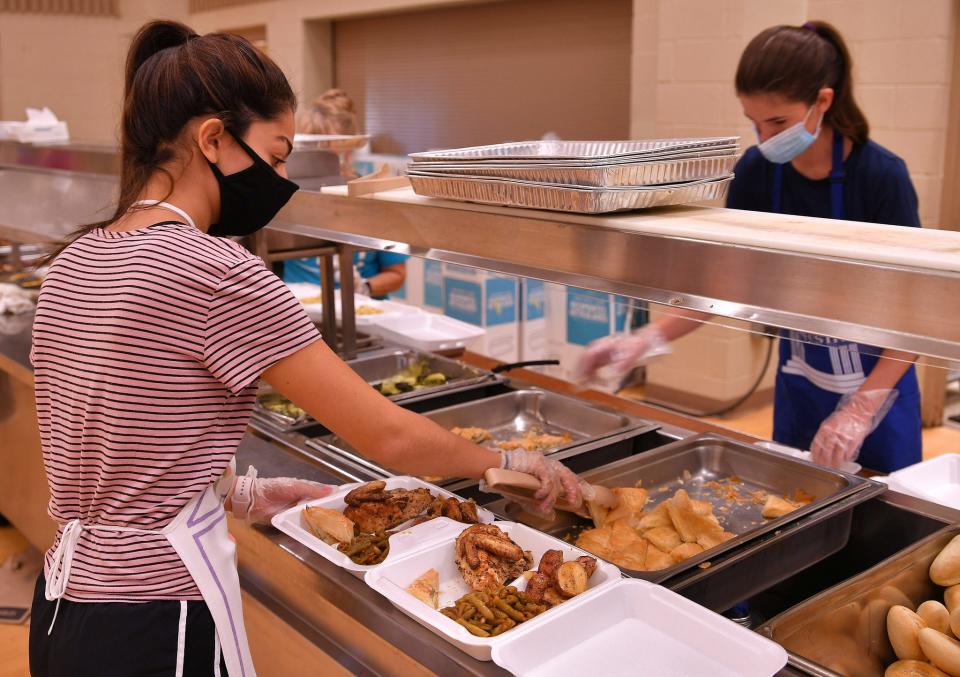 The 2020 Spartanburg Greek Festival is holding its "A Taste of Greece To-Go," at the St. Nicholas Greek Orthodox Church in Spartanburg, Friday, September 18, 2020. Mary Marzouka, left, and Virginia Skybo, right, work to pack to-go plates for hungry customers. The 27th annual festival is unable to share the usual onsite festivities, but the delicious food, from Greek chicken and souvlaki to gyros and baklava, is available to go. Orders can also be placed by phone or online for drive thru pickup and delivery. Tips received through the online service will benefit Mobile Meals of Spartanburg.