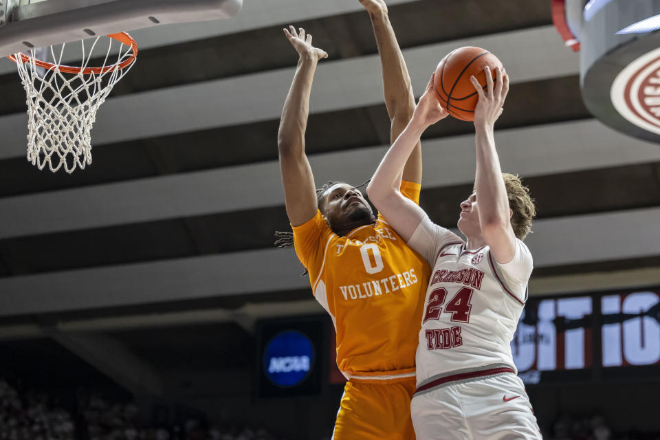 Alabama forward Sam Walters (24) looks for a shot against Tennessee forward Jonas Aidoo (0) during the second half of an NCAA college basketball game Saturday, March 2, 2024, in Tuscaloosa, Ala. (AP Photo/Vasha Hunt)