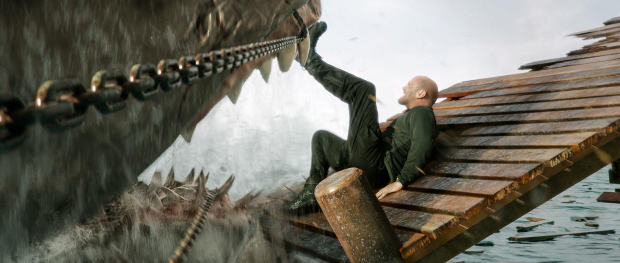 Jason Statham and a shark in a scene from Meg 2: The Trench