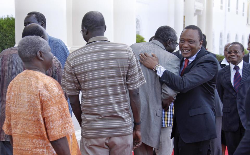 In this photo released by the Kenya Presidency, Kenya's President Uhuru Kenyatta, 2nd right, receives seven of the 11 leaders accused of plotting a failed military coup in South Sudan in December, after they were flown to Kenya where they will still be held in custody according to a spokesman for South Sudan's president, in Nairobi, Kenya Wednesday, Jan. 29, 2014. South Sudan's Justice Minister Paulino Wanawilla Unago said the detainees will be in Kenya for the duration of the investigation "for their own safety" but will return to face trial. (AP Photo/Kenya Presidency)