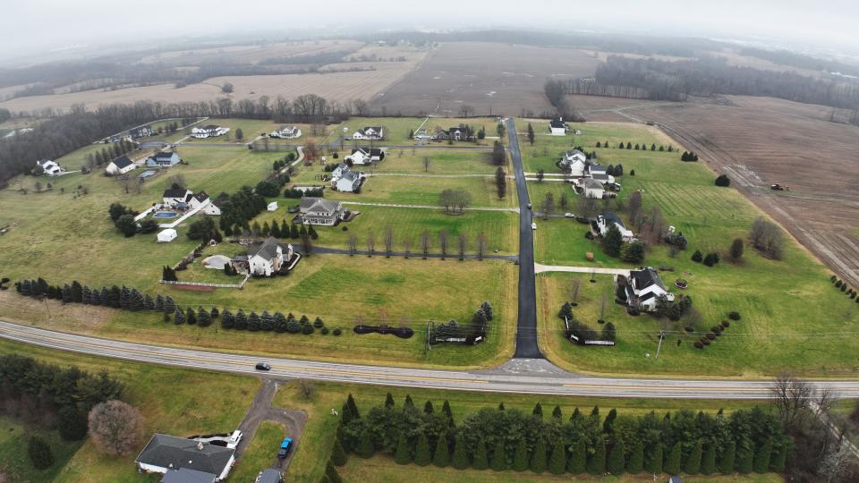 Residents in the Green Pointe neighborhood along Ohio 37, shown here Dec. 28, are trying to vacate, or permanently close, about 200 feet of Green Pointe Drive to stop it from being an access road to a possible huge development on farmland around of the community.