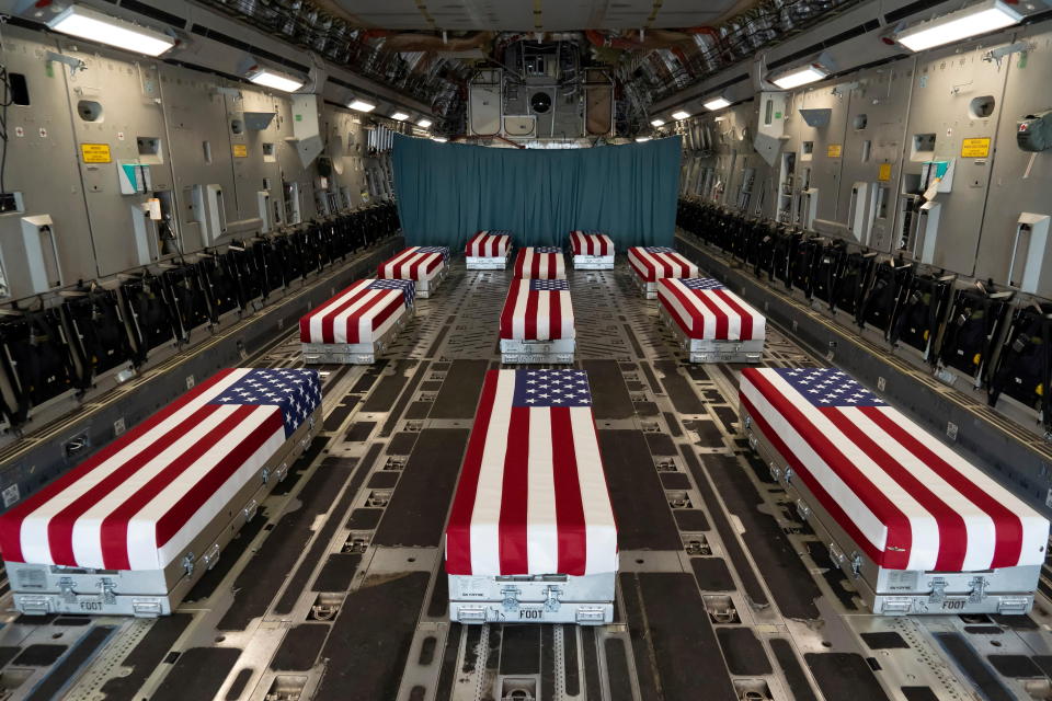 Flag-draped transfer cases of U.S. military service members who were killed by an August 26 suicide bombing at Kabul's Hamid Karzai International Airport line the inside of a C-17 Globemaster II prior to a dignified transfer at Dover Air Force Base, Delaware, U.S., August 29, 2021.   U.S. Marines/Handout via REUTERS THIS IMAGE HAS BEEN SUPPLIED BY A THIRD PARTY.