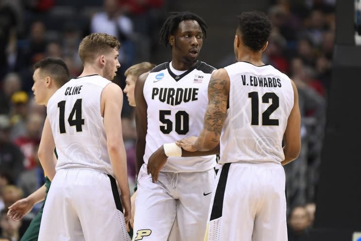 Caleb Swanigan (middle) is flanked by four starters who shoot 40 percent or better from beyond the arc. (Getty)