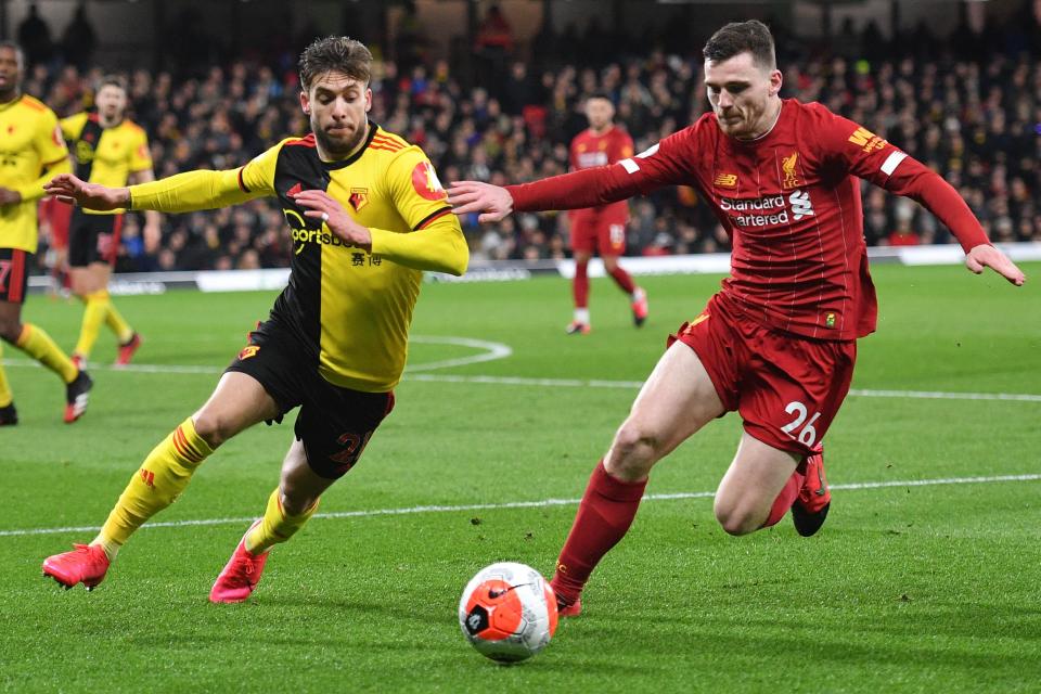 Watford's Spanish defender Kiko Femenia (L) vies with Liverpool's Scottish defender Andrew Robertson during the English Premier League football match between Watford and Liverpool at Vicarage Road Stadium in Watford, north of London on February 29, 2020. (Photo by JUSTIN TALLIS / AFP) / RESTRICTED TO EDITORIAL USE. No use with unauthorized audio, video, data, fixture lists, club/league logos or 'live' services. Online in-match use limited to 120 images. An additional 40 images may be used in extra time. No video emulation. Social media in-match use limited to 120 images. An additional 40 images may be used in extra time. No use in betting publications, games or single club/league/player publications. /  (Photo by JUSTIN TALLIS/AFP via Getty Images)