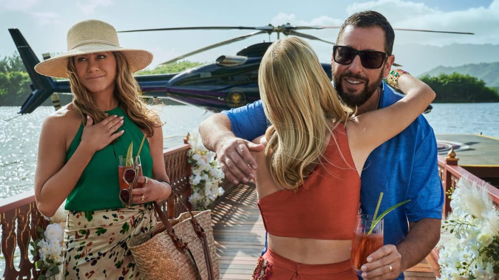 Murder Mystery 2. (L to R) Jennifer Aniston as Audrey Spitz, Melanie Laurent as Claudette Joubert and Adam Sandler as Nick Spitz in Murder Mystery 2. Cr. Scott Yamano/Netflix © 2023.