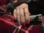 This photo shows Mrs. Claus' holiday-themed fingernails during a plane ride trip to Nuiqsut, Alaska, on Tuesday, Nov. 29, 2022. Operation Santa Claus, the Alaska National Guard's outreach program, attempts to bring Santa and Mrs. Claus and gifts to children in two or three Alaska Native villages each year. (AP Photo/Mark Thiessen)