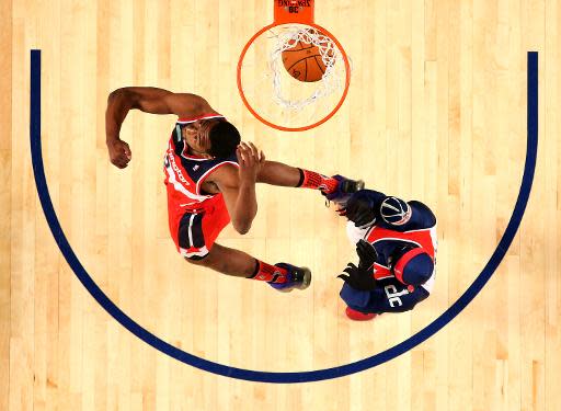 El armador John Wall, de los Washington Wizards de la Conferencia Este, haciendo un mate en la competición de la NBA All-Star, el 15 de febrero de 2014 (Getty/AFP | Ronald Martinez)