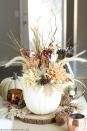 <p>The arrangement of pinecones, branches, and burlap leaves inside this white pumpkin borders both rustic and elegant.</p><p><em><a href="http://apumpkinandaprincess.com/2015/09/diy-pumpkin-vase.html" rel="nofollow noopener" target="_blank" data-ylk="slk:Get the tutorial at A Pumpkin and a Princess »;elm:context_link;itc:0;sec:content-canvas" class="link ">Get the tutorial at A Pumpkin and a Princess »</a></em></p>