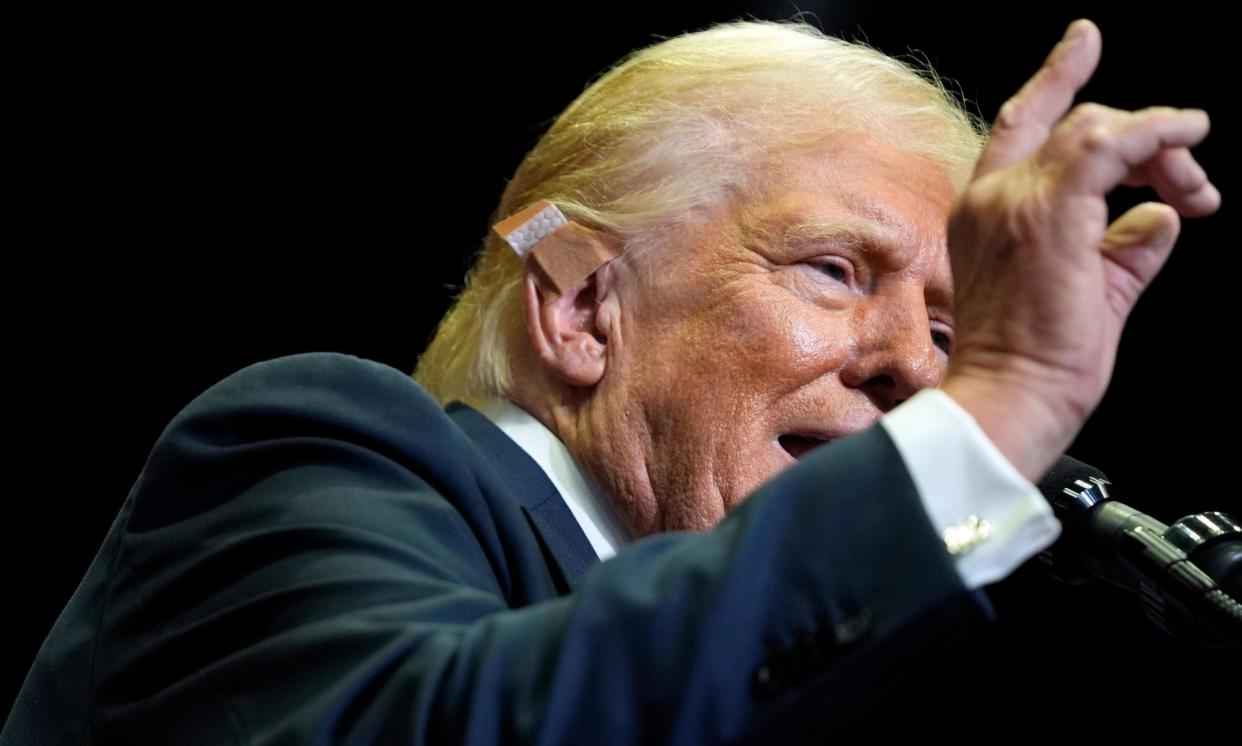 <span>Donald Trump speaks in Grand Rapids, Michigan.</span><span>Photograph: Evan Vucci/AP</span>