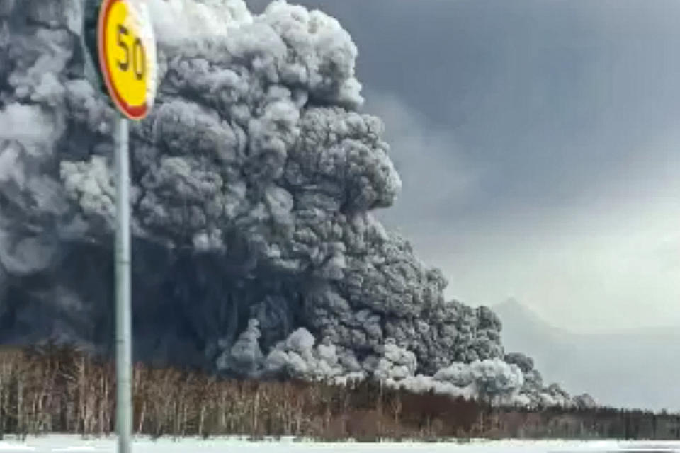 Smoke and ash are visible during the the Shiveluch volcano's eruption on the Kamchatka Peninsula in Russia, Tuesday, April 11, 2023. Shiveluch, one of Russia's most active volcanoes, erupted Tuesday, spewing clouds of ash 20 kilometers into the sky and covering broad areas with ash. (Alexander Ledyayev via AP)