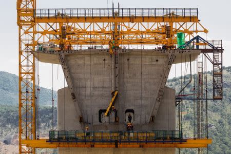 Workers are seen at the bridge construction site of the Bar-Boljare highway in Bioce, Montenegro June 11, 2018. REUTERS/Stevo Vasiljevic