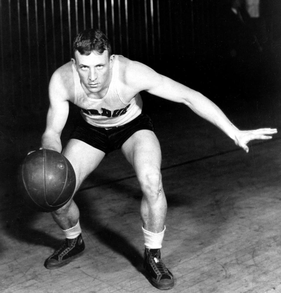 John Wooden, guard for Purdue University, poses in action in West Lafayette, Ind., in this undated photo. As a student at Purdue, Wooden was the All-American basketball player for three years, 1930-1932, and Player of the Year in 1932.