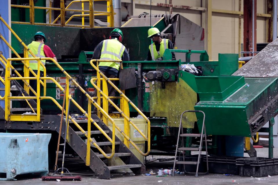 In this 2019 photo, workers sort the plastic bottles to be bundled and cut for recycling at the new location for Parallel Products in New Bedford's industrial park. The city has reached a host community agreement with Parallel Products that bans all biosolids – also known as sewage sludge – from its processing plant expansion.