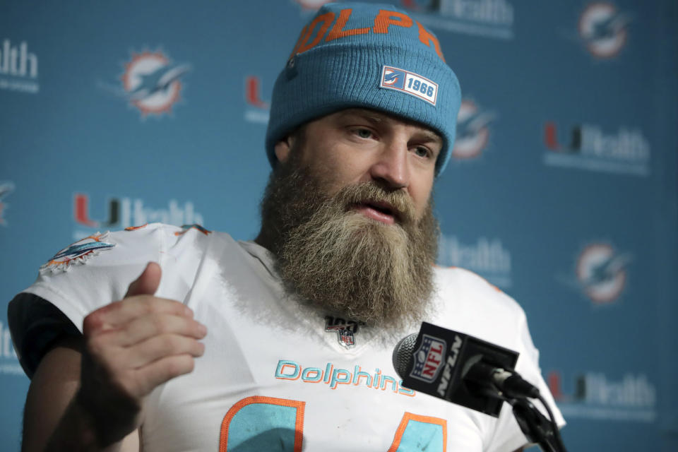 FILE - In this Dec. 29, 2019, file photo, Miami Dolphins quarterback Ryan Fitzpatrick speaks to the media following an NFL football game against the New England Patriots in Foxborough, Mass. Quarterback facial hair is sure to be front and center when the Jacksonville Jaguars (1-1) host the Miami Dolphins (0-2) on Thursday night, Sept. 24, 2020. Miami’s Ryan Fitzpatrick has a bushy beard that covers much of his face and engulfs his chin strap; Jacksonville’s Gardner Minshew has a unkept horseshoe mustache that seems to go perfectly with his flowing locks. (AP Photo/Charles Krupa, File)