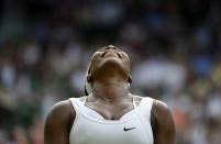Serena Williams of the U.S.A. reacts after missing a point during her match against Timea Babos of Hungary at the Wimbledon Tennis Championships in London, July 1, 2015. REUTERS/Toby Melville TPX IMAGES OF THE DAY