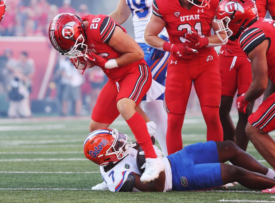 Utah Utes safety Briton Allen (26) makes a tackle for loss against Florida Gators running back Trevor Etienne (7) in Salt Lake City on Thursday, Aug. 31, 2023 during the season opener. Utah won 24-11.