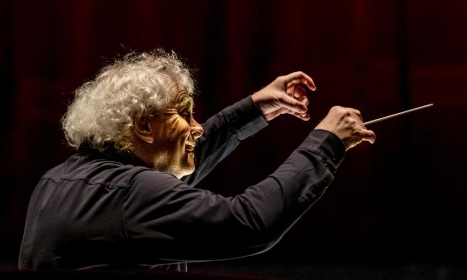 Sir Simon Rattle conducts earlier this year